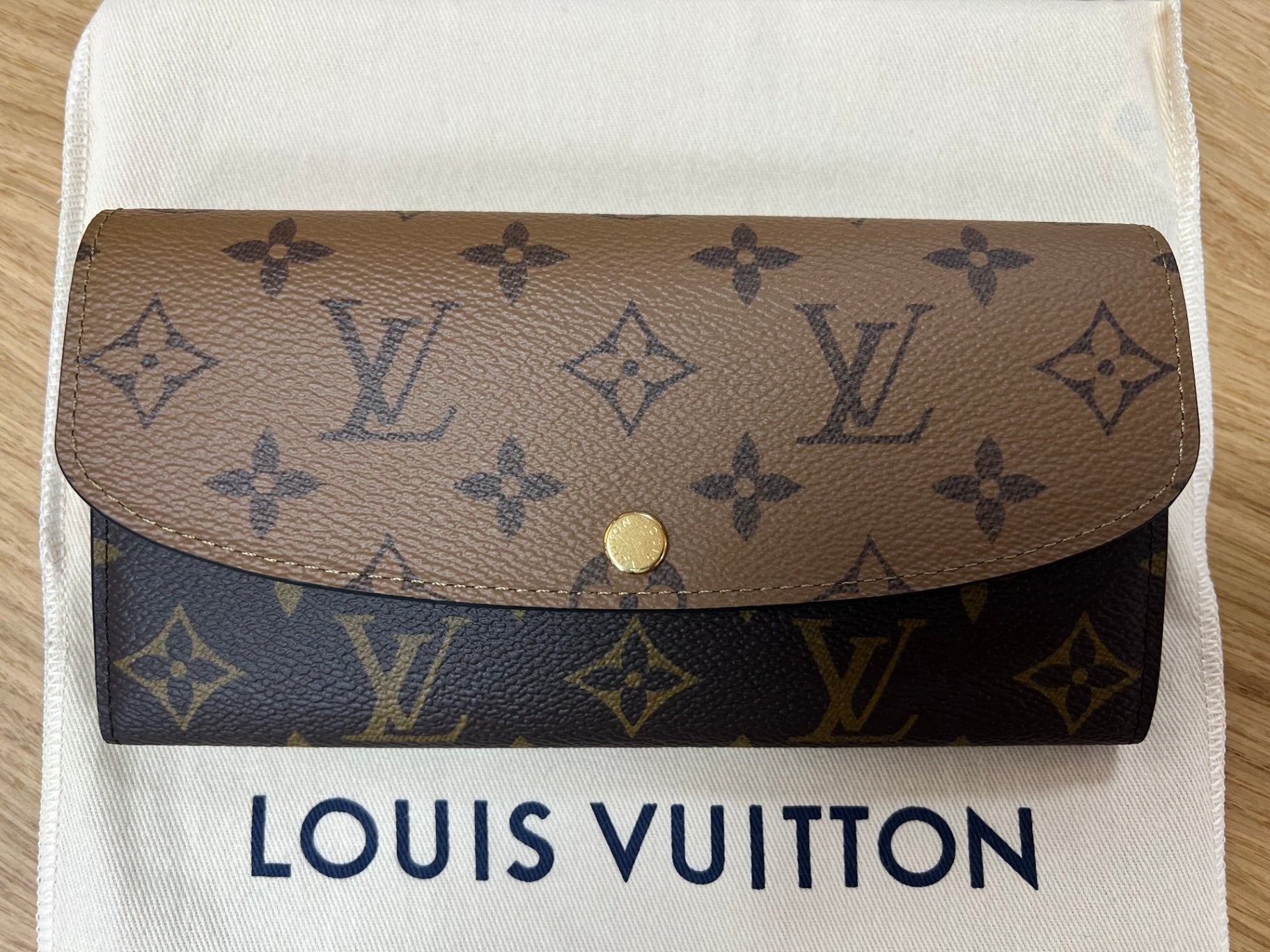 Louis Vuitton Portemonaie Emilie Braun, Schwarz, Gold Coated Canvas mit zweifarbigem Monogram